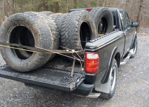 used tires in bed of a pickup truck